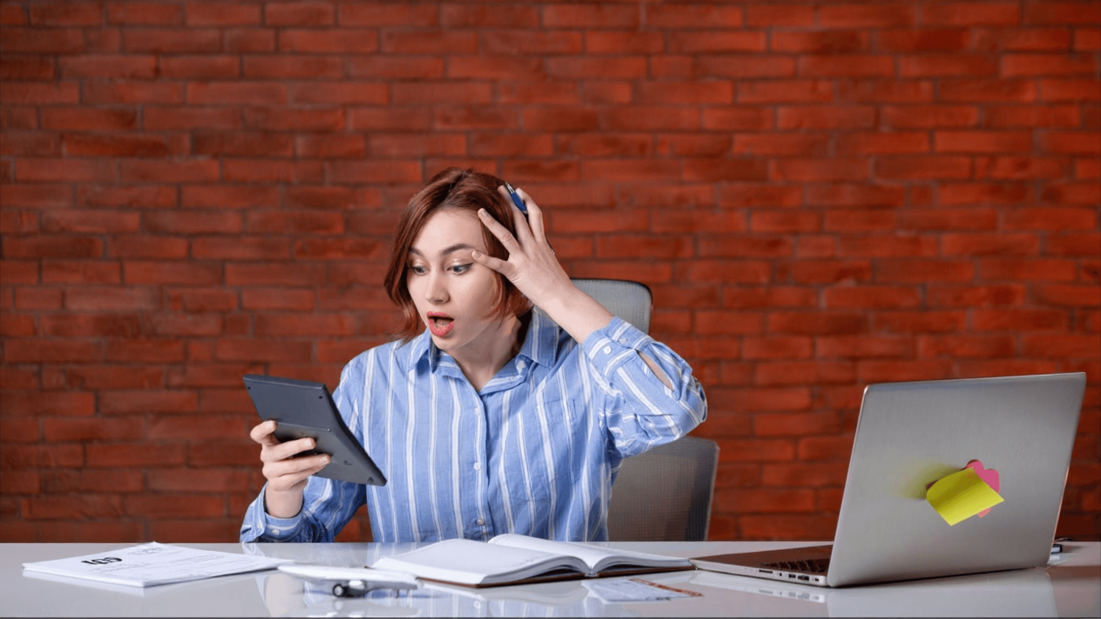 Shocked 1099 creator reviewing tax numbers at a desk without CPA support, highlighting the stress of handling freelance taxes alone.