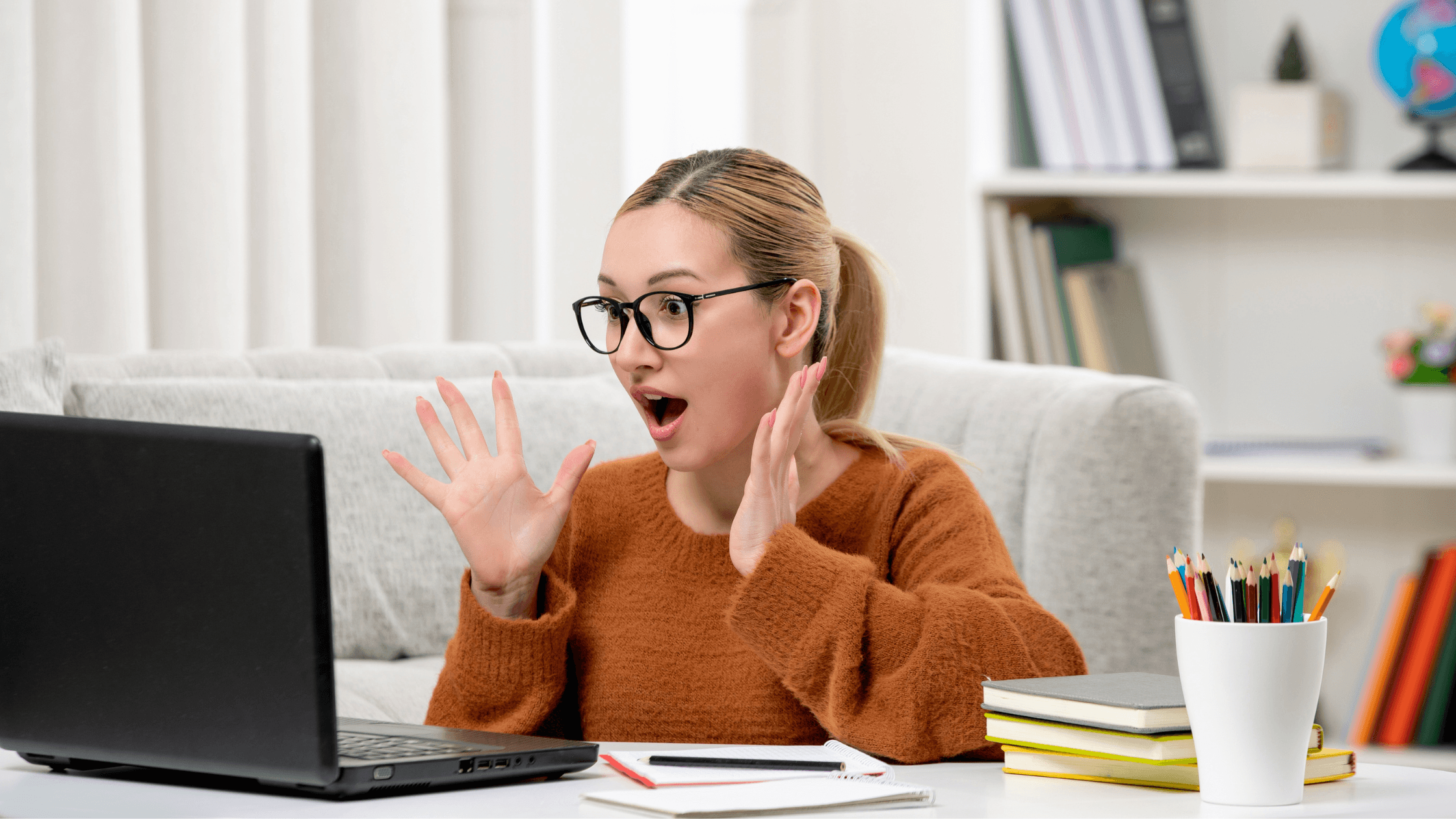 Surprised creator looking at a laptop after seeing a high tax bill or unexpected estimated tax amount.